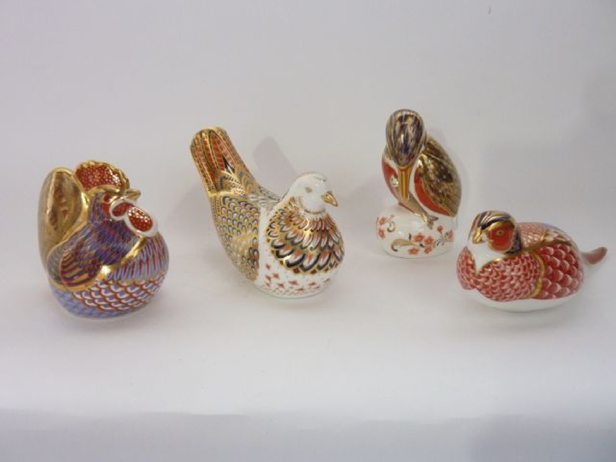 Appraisal: A collection of four Royal Crown Derby paperweights with Imari