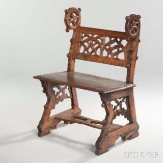 Appraisal: Continental Gothic Walnut Hall Seat with carved wheel-form ears and