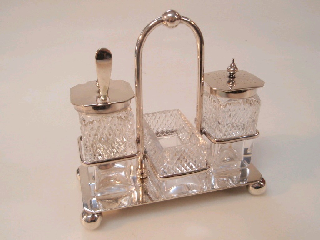 Appraisal: An early thC plated condiment set with cut glass cruets