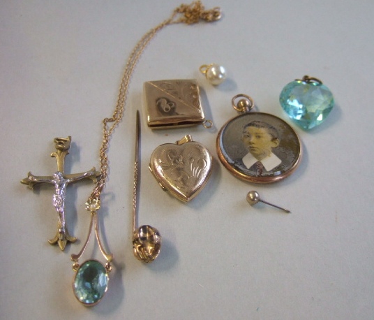 Appraisal: A gold half pearl and pale blue gem set pendant