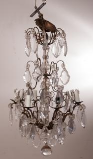 Appraisal: French Crystal Chandelier Crystals decorate this French eight-prong chandelier measures