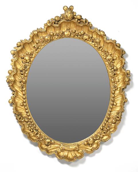 Appraisal: A pair of Continental Rococo style giltwood oval mirrors height