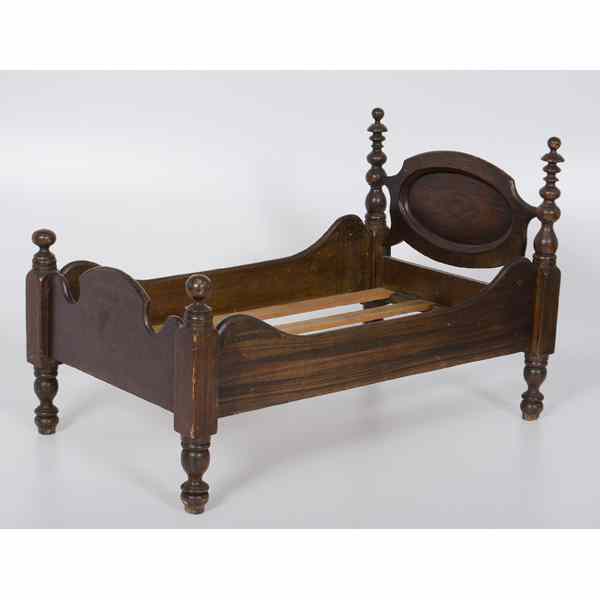 Appraisal: Walnut Doll Bed American th century A turned wooden doll