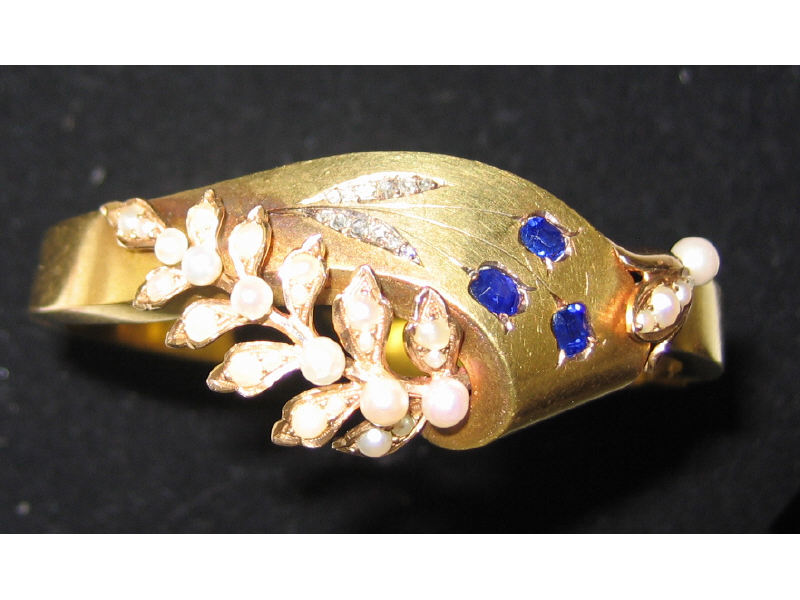 Appraisal: VICTORIAN PEARL DIAMOND AND SAPPHIRE BANGLE k yellow gold Late