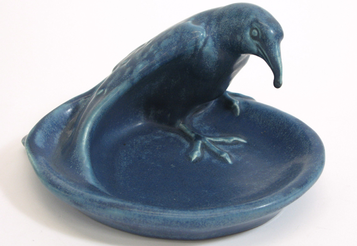 Appraisal: ROOKWOOD ART POTTERY ROOK BIRD FIGURE standing over a pool