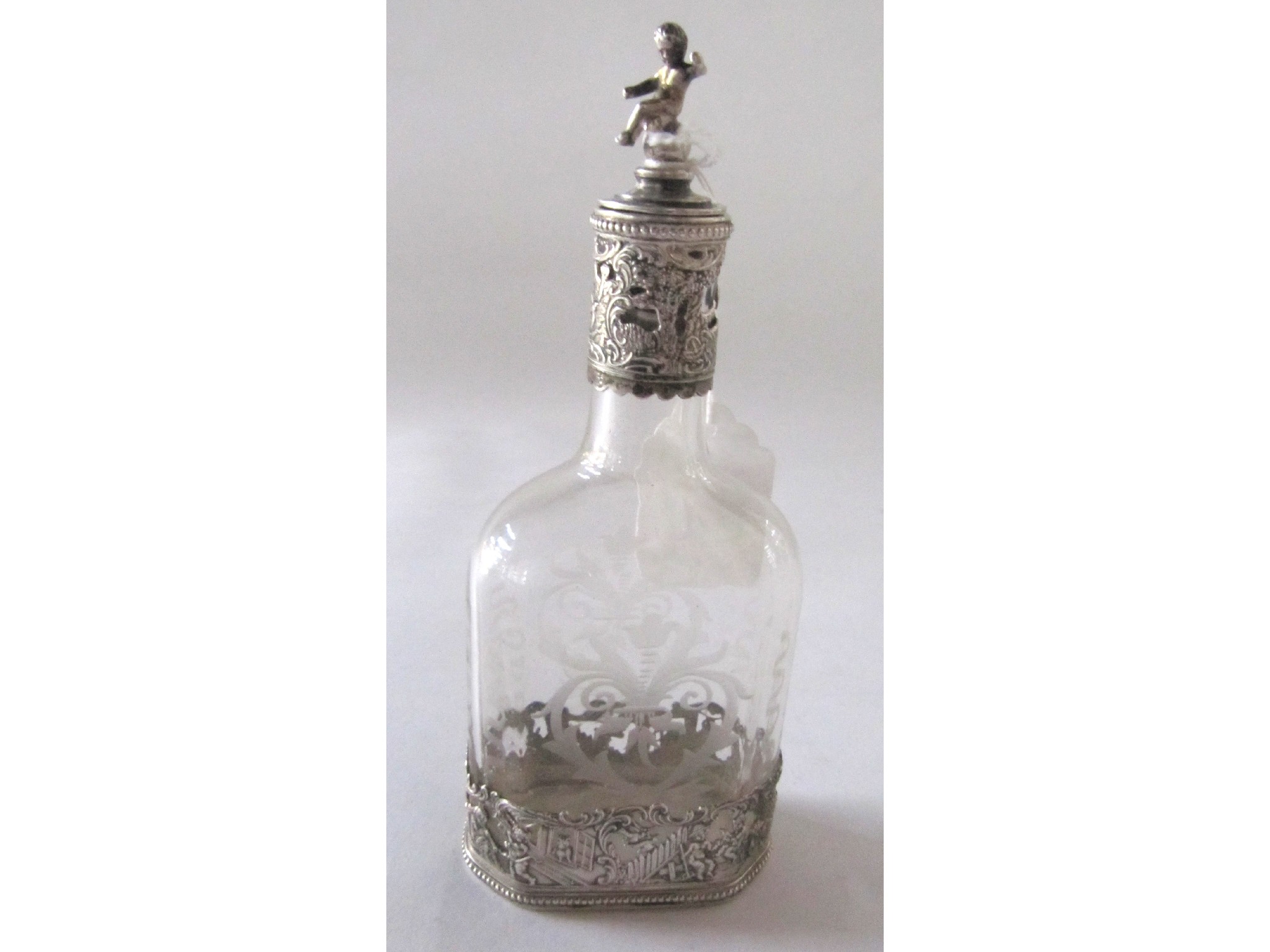 Appraisal: A continental silver overlaid etched glass bottle import marks for