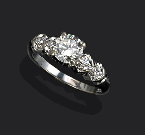 Appraisal: A diamond ring centering a round-brilliant cut diamond weighing approximately