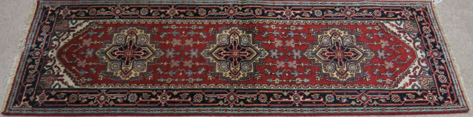 Appraisal: HAND KNOTTED ORIENTAL AREA RUG Persian Serapi design the lightly