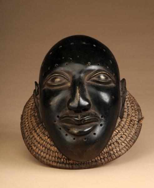 Appraisal: African Mask Description Made of brass and raffia Condition Good