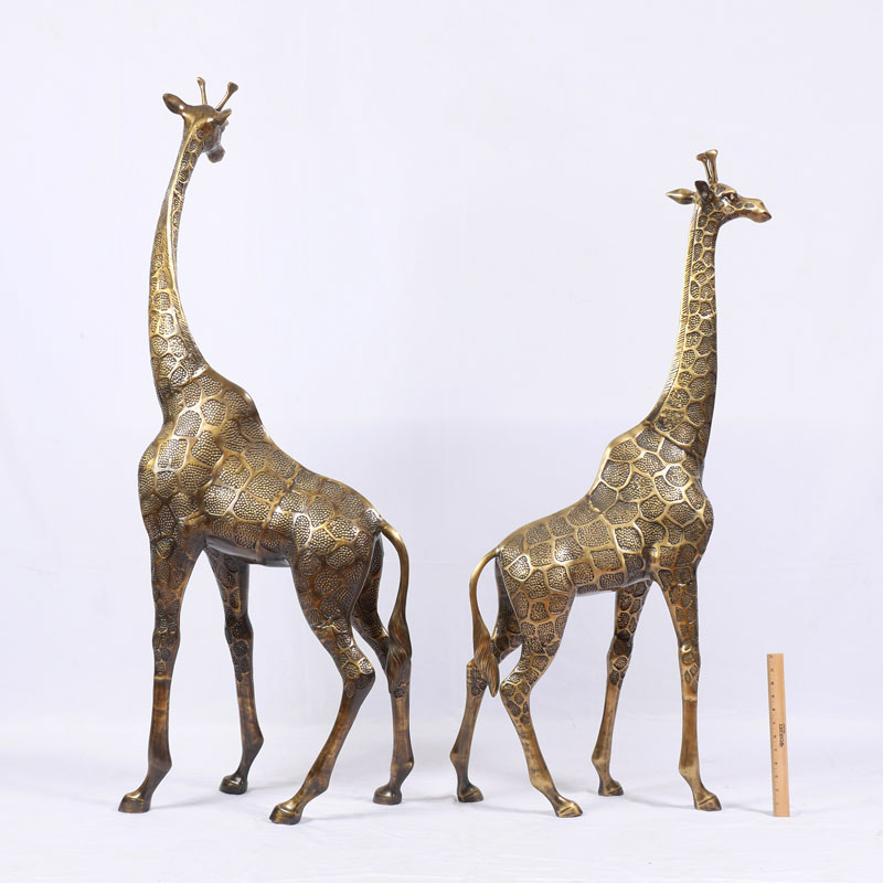 Appraisal: PAIR OF BRASS FIGURAL GIRAFFES Cast brass th century production