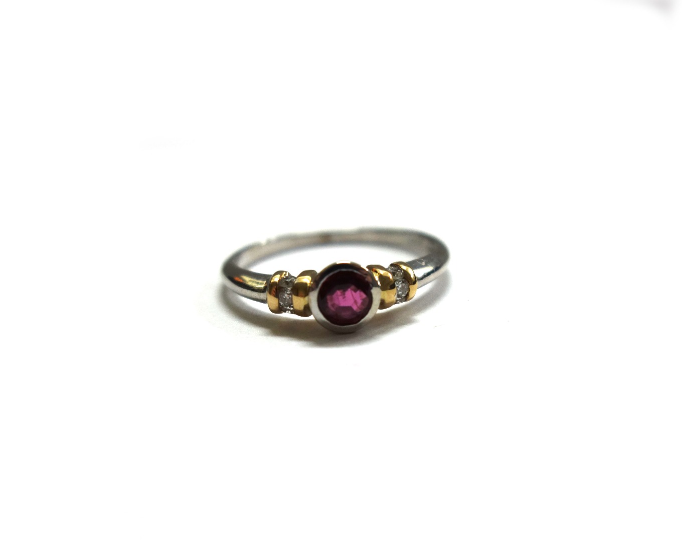 Appraisal: A modern ct gold ruby and diamond ring centred with