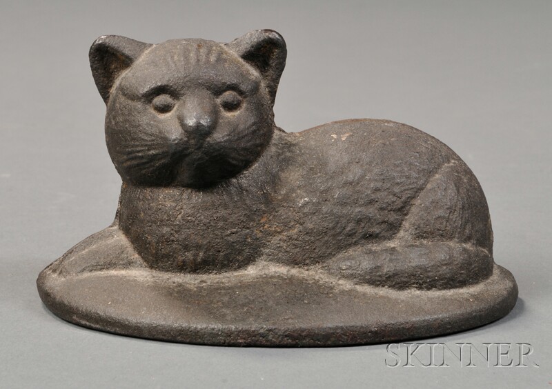 Appraisal: Small Cast Iron Recumbent Cat Doorstop America early th century