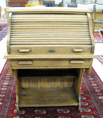 Appraisal: PETITE OAK ROLL-TOP WRITING DESK American c having a sliding