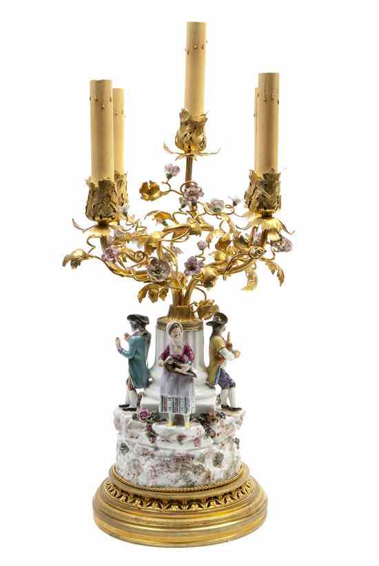 Appraisal: A French Gilt Bronze and Porcelain Mounted Five-Light Figural Candelabrum