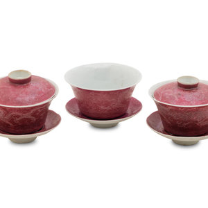 Appraisal: Three Famille Rose Pink Ground Incised Tea Bowls comprising a