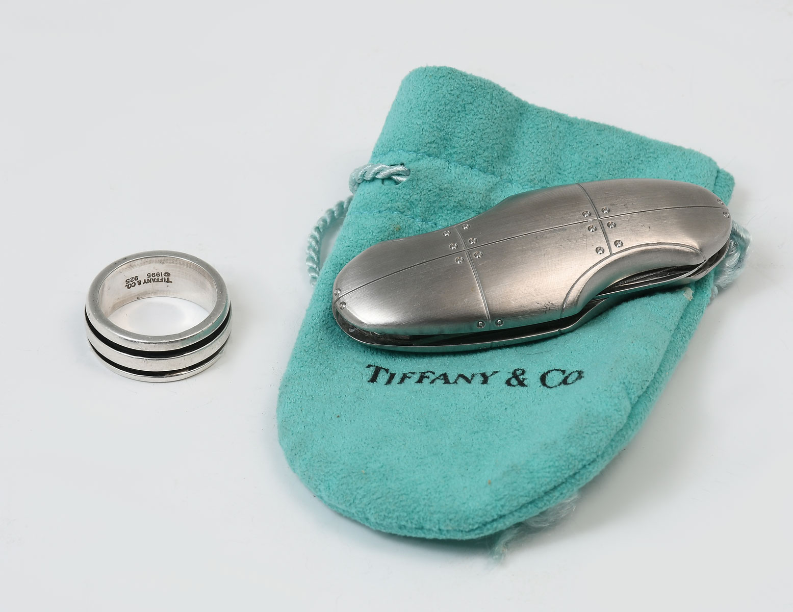 Appraisal: TIFFANY CO - STERLING BAND AND POCKET KNIFE great Tiffany