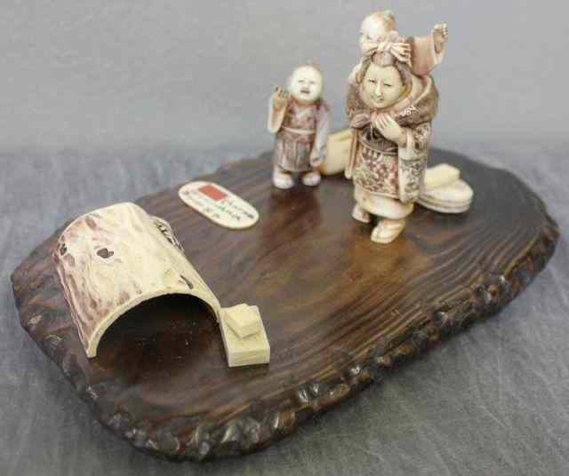 Appraisal: Asian Ivory Multi-figure Group on a Wood Stand From a