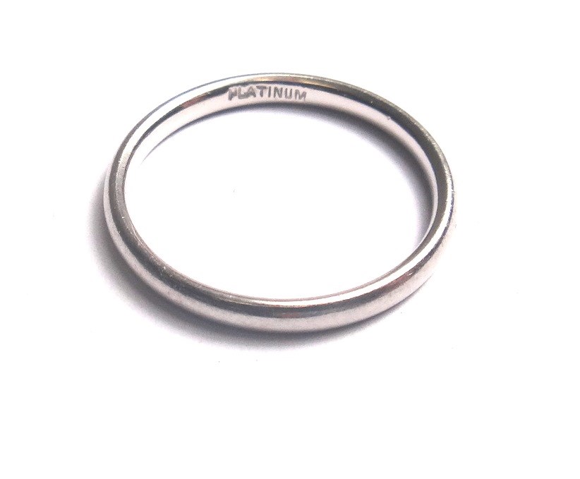 Appraisal: A platinum plain wedding ring detailed Platinum ring size O