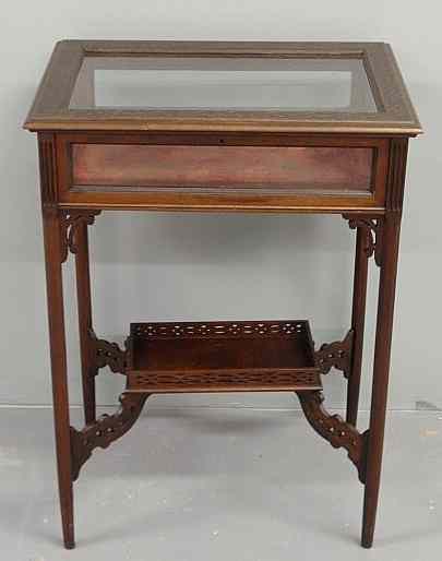 Appraisal: Chippendale style mahogany curio table with blind fretwork top and