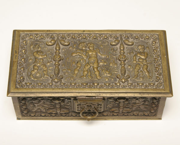 Appraisal: Antique brass box decorated with putti within a floral border