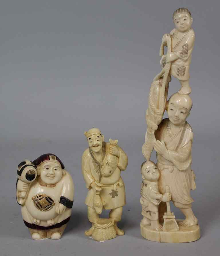 Appraisal: THREE JAPANESE IVORY OKIMONO MEIJI PERIOD including a carved fisherman