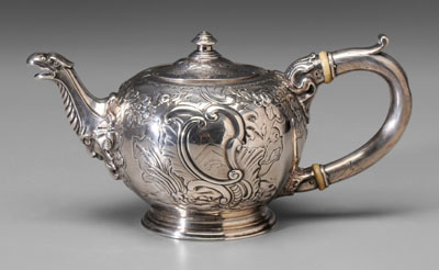 Appraisal: George II Silver Teapot London round with rococo floral shell