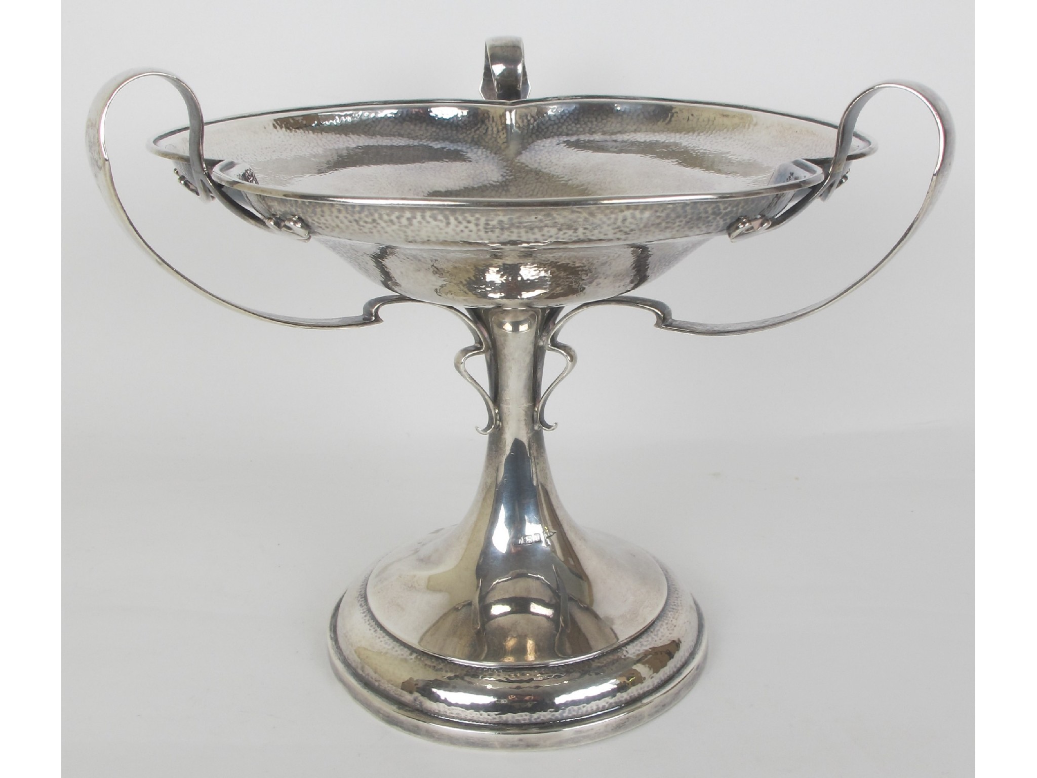 Appraisal: An Arts Crafts hammered silver comportby Walker and Hall Sheffield