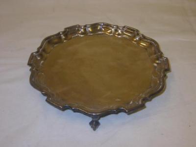 Appraisal: A CARD TRAY of circular form with Chippendale border raised