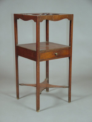 Appraisal: A mahogany three tier single drawer wash stand early th