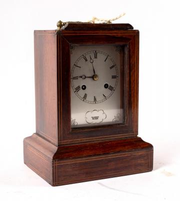 Appraisal: A rosewood cased mantel clock the silvered dial signed Valery