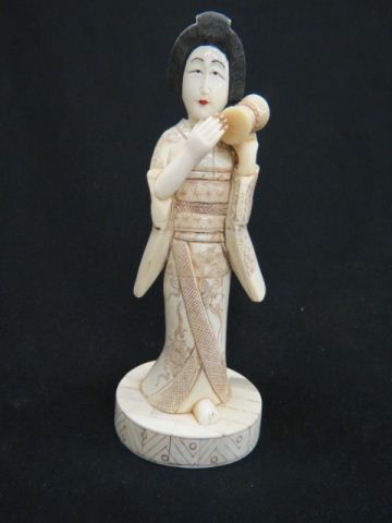 Appraisal: Japanese Carved Bone Figurine of a Geisha holding a small