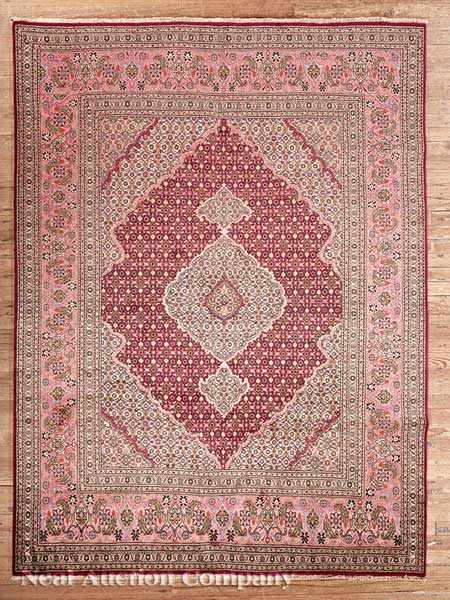 Appraisal: A Persian Tabriz Carpet crimson and pink ground central lozenge