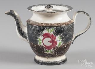 Appraisal: Black and brown rainbow spatter teapot with Adams rose decoration