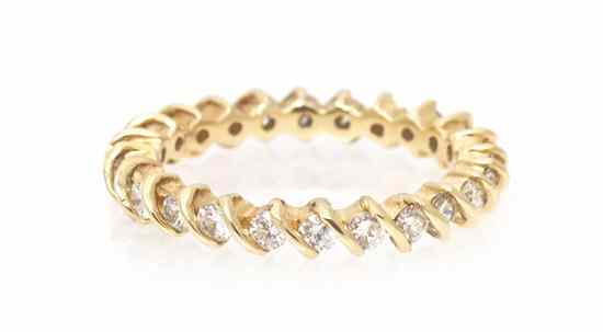 Appraisal: A Karat Yellow Gold and Diamond Eternity Band Ring containing