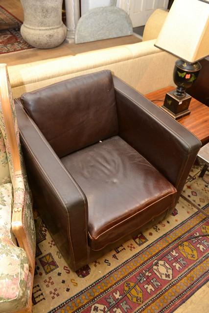 Appraisal: A PAIR OF MID CENTURY BROWN LEATHER ARM CHAIRS