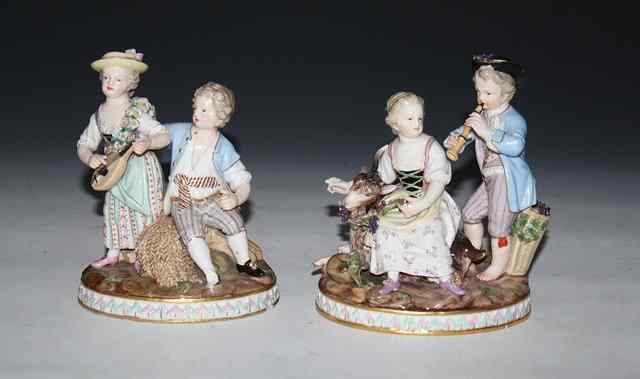 Appraisal: A PAIR OF CONTINENTAL PORCELAIN GROUPS each of a boy