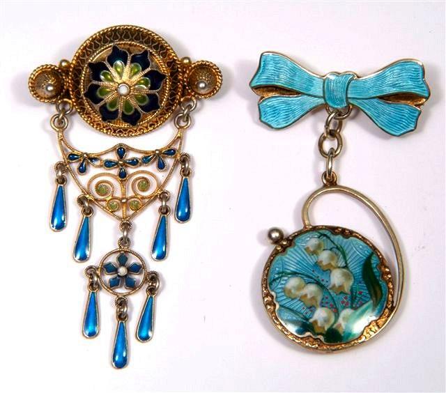 Appraisal: A CONTINENTAL ENAMELLED BOW BROOCH with suspended silver and enamelled