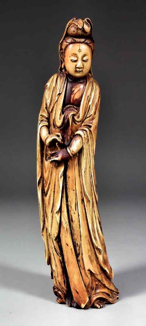 Appraisal: A Chinese carved ivory standing figure of Guanyin ins mm