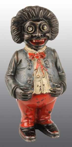 Appraisal: Cast Iron Golliwog Still Bank Description Manufactured by John Harper