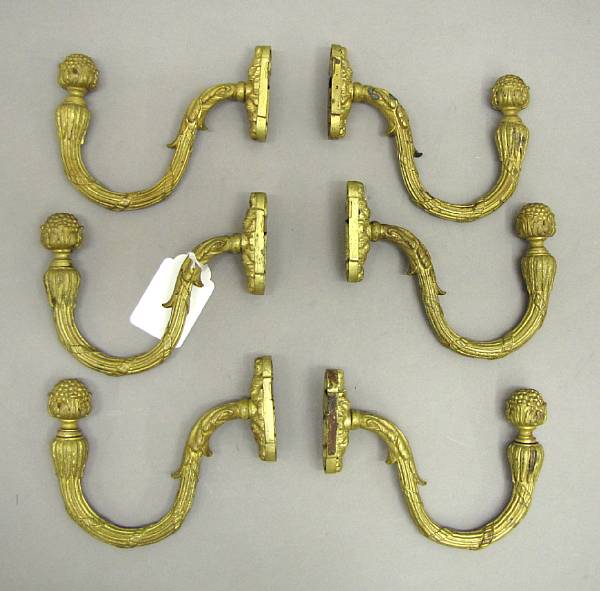 Appraisal: A set of four Louis XVI style gilt bronze drapery