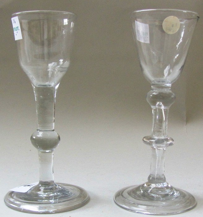 Appraisal: Two wine glasses mid th century the first with rounded