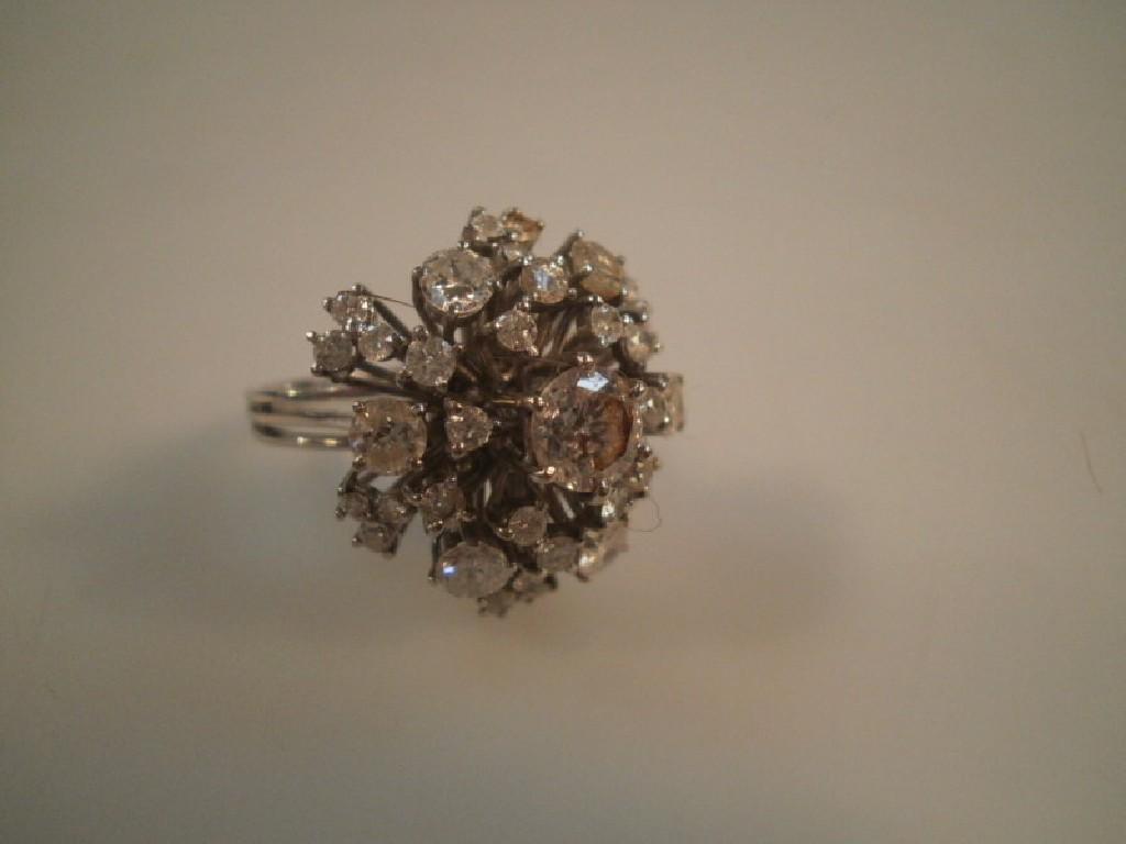 Appraisal: A large open diamond cluster ring centre stone of ct