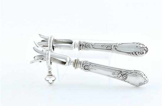 Appraisal: French silver bone holders Paris th century each hollow handle