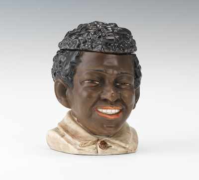 Appraisal: A Majolica Black Boy Head Tobacco Jar Ceramic head with