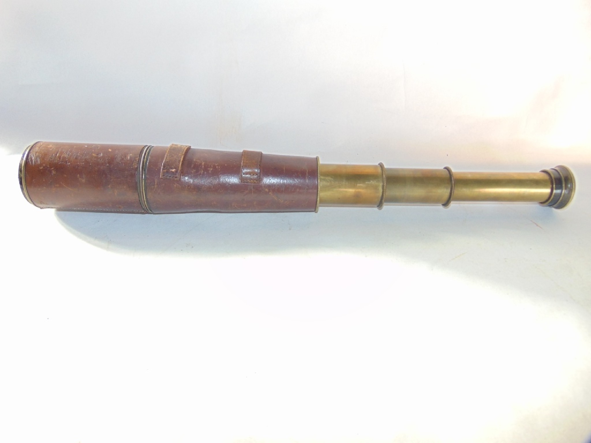 Appraisal: A First World War brass three draw telescope stamped T