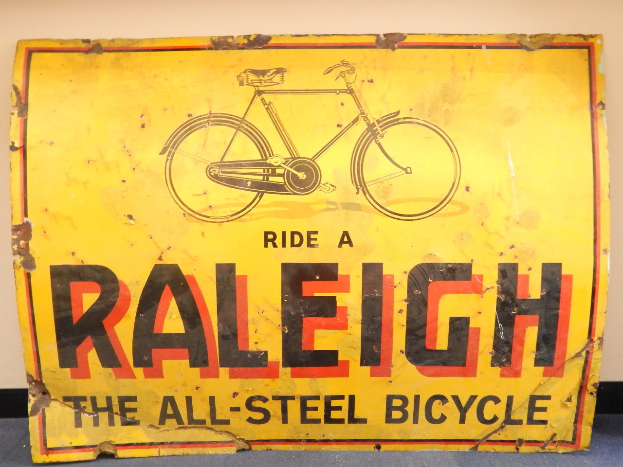 Appraisal: An enamel sign for Raleigh Ride on Raleigh The All-Steel