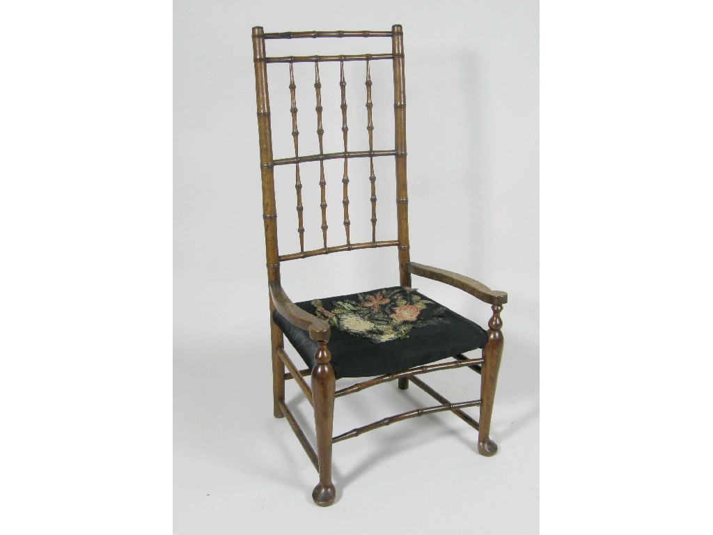 Appraisal: A th Century simulated bamboo Elbow Chair having upholstered seat