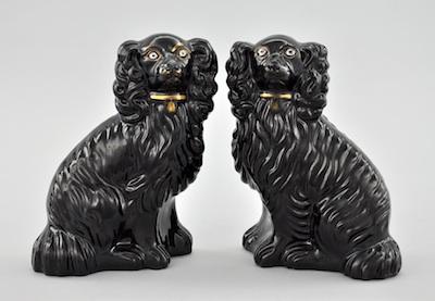 Appraisal: A Pair of Staffordshire Black Glazed King Charles Spaniels The