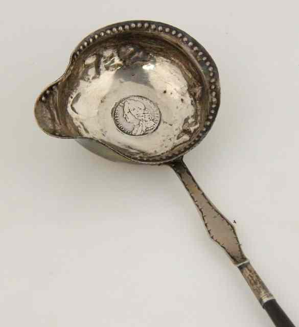 Appraisal: An th Century silver toddy ladle unmarked with twisted whalebone