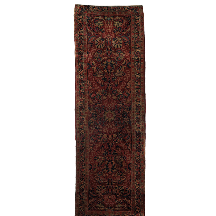 Appraisal: Persian Sarouk runner c floral design on a red field